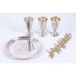 A 20th Century Russian - Estonian hallmarked silver three small goblets on a circular tray and