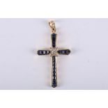 An 18 carat yellow gold, diamond, and sapphire set cross pendant, L: 3.5cm, together with a pearl