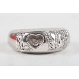 Chopard, Geneve. An 18 carat white gold and diamond set 'Love' ring, the 'o' having a loose '