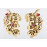 A pair of 18 carat yellow gold, diamond, and ruby earrings, of leaf form. L: 2.7cm