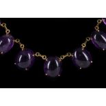 An 18 carat yellow gold and amethyst necklace, set 21 oval cabouchon cut amethysts with link