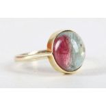 A 14 carat yellow gold and tourmaline ring, set oval cabouchon stone. Size: M 1/2 Weight, 4g