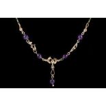 A 9 carat yellow gold and amethyst drop pendant necklace, having five round cut amethyst beads