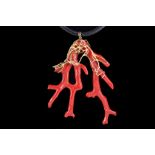 An unusual bespoke 18 carat yellow gold and coral pendant, having openwork-mounted coral branch,