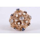 A 9 carat yellow gold, diamond, pearl, and sapphire set floral cluster boule ring, the three old cut