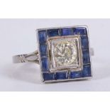 An Art Deco platinum, diamond, and sapphire ring, set round cut diamond of approx. 1.0 carats,