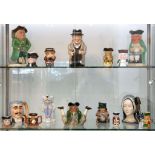 A collection of character jugs including Winston Churchill and Anne Boleyn