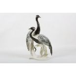 A figural porcelain group of 2 cranes, possibly by Karl Ernst.