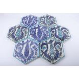 A set of Persian hexagonal tiles with birds and flowers in shades of blue, 19cm wide (7).