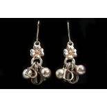 CHRISTIAN DIOR EARRINGS, silver tone with DIOR and flower charm, with box