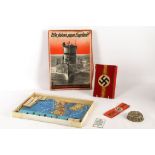 WWII German Nazi memorabilia; small jelly / cake mould with swastika emblem, party cuff braiding,