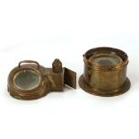 An early 20th century ship's binnacle compass, brass 'bell' shape with oil lamp housing, stamped