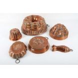 A selection of Victorian and later copper jelly moulds in varying shapes and sizes (6).