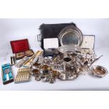 A quantity of silver plate to include a large twin handled tray, a shell and scroll edged footed