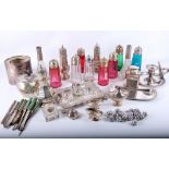 A collection of sugar shakers, many with coloured glass and plated tops, silver plated examples