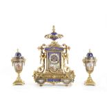 A LATE 19TH CENTURY FRENCH GILT BRONZE AND PORCELAIN MOUNTED CLOCK GARNITURE the case surmounted