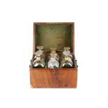 A GEORGE III MAHOGANY DECANTER BOX WITH SIX DECANTERS the box with cylinder top, with brass swing