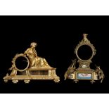 TWO MID 19TH CENTURY FRENCH GILT BRONZE FIGURAL CLOCK CASES the first modelled as a reclining maiden