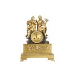 A FRENCH EMPIRE PERIOD GILT AND PATINATED BRONZE FIGURAL CLOCK DEPICTING TERPSICHORE AND PAN