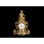 A MID 19TH CENTURY FRENCH GILT BRONZE FIGURAL MANTEL CLOCK the case modelled as a fluted column hung