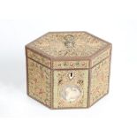 A GEORGE III ROLLED PAPER 'FILIGREE' AND INLAID TEA CADDY of hexagonal form, the top and sides all