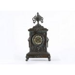 A LATE 19TH CENTURY FRENCH BRONZE MANTEL CLOCK  the plinth case surmounted by a twin handled urn,