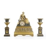 AN EARLY 19TH CENTURY FRENCH GILT AND PATINATED BRONZE FIGURAL MANTEL CLOCK GARNITURE modelled as