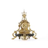 A LATE 19TH CENTURY FRENCH GILT BRONZE MANTEL CLOCK IN THE MANNER OF BARBEDIENNE in the Neo-Grec