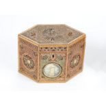 A GEORGE III ROLLED PAPER 'FILIGREE' AND HAREWOOD INLAID TEA CADDY of hexagonal form, the top and