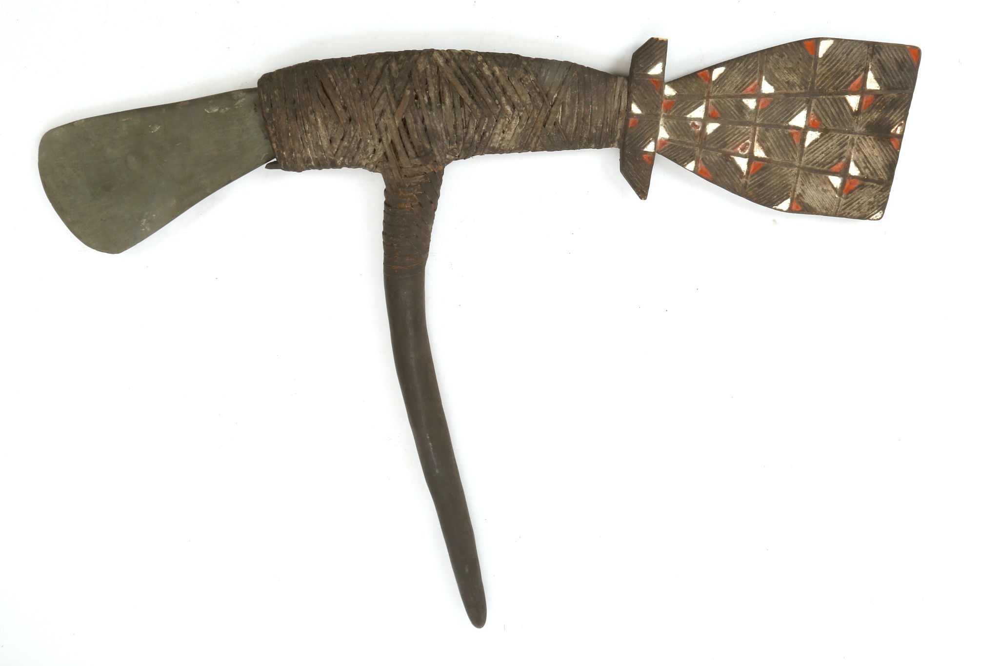 A LARGE ETHNOGRAPHIC SCHIST AXEHEAD 32.4cm long; with a wooden haft, 72cm high (2)