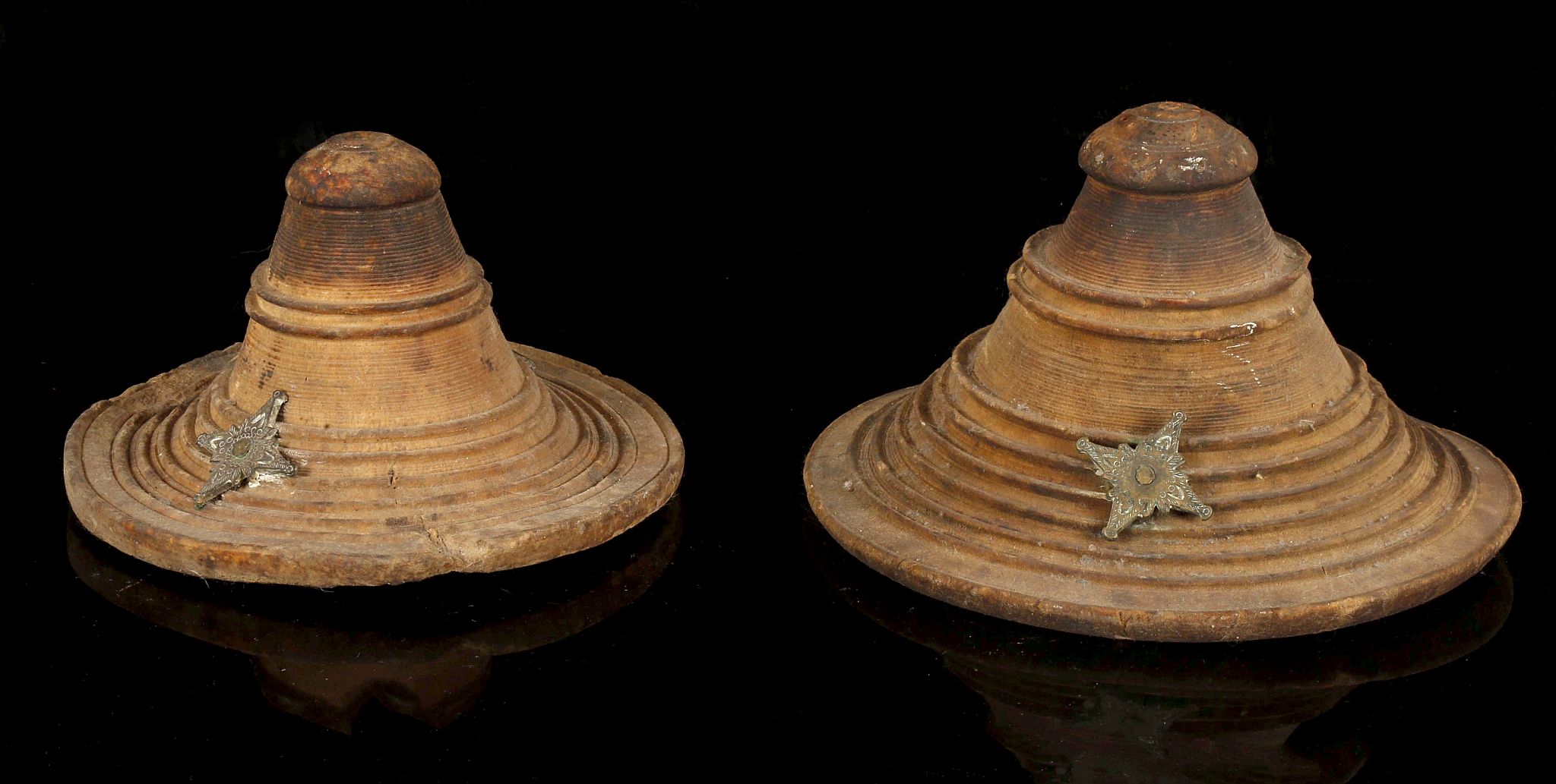 TWO HIDE SHIELDS, SULTANATE OF OMAN, SOMALIA AND EAST ETHIOPIA Decorated with ribs and applied metal