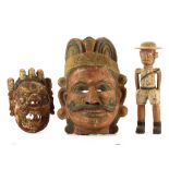 TWO ETHNOGRAPHIC MASKS AND A COLON FIGURE Including one mask from Mexico, 52cm high, and another