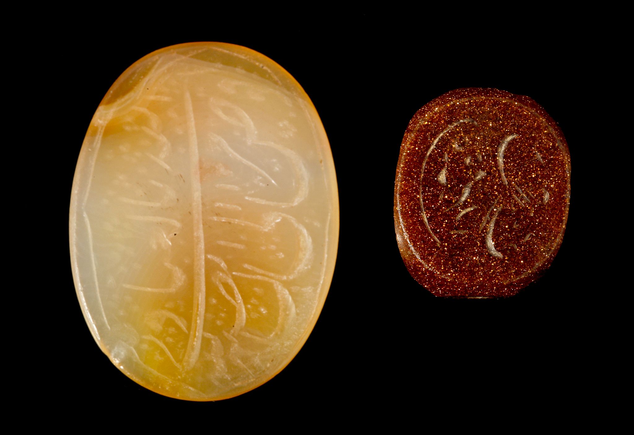 TWO PERSIAN SEALS Qajar, circa 20th Century A.D. Including an oval carnelian example and a prismatic