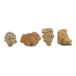 FOUR PRE-COLUMBIAN TERRACOTTA HEADS, MEXICO Including two Teotihyacan examples, an Aztec head of a