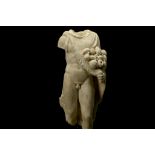 A ROMAN MARBLE TORSO OF SILVANUS Circa 2nd Century A.D. Depicted nude, with the weight on his