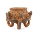 A PRE-COLUMBIAN POTTERY ZOOMORPHIC BOWL, COSTA RICA Raised over three feet, decorated in relief with