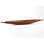 A SOUTH PACIFIC FEAST BOWL Of elongated shape, with terminals for hanging, 76cm long