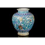 AN IZNIK POTTERY VASE Circa 19th Century Decorated with floral motifs, 30cm high