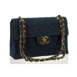 CHANEL MAXI DENIM FLAP BAG, date code for 1989/91, dark blue quilted denim and gilt tone hardware,