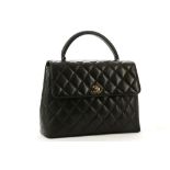 CHANEL QUILTED KELLY STYLE HANDBAG, 1990s, black quilted leather with leather top handle and gilt