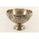A large silver plated footed punch bowl with raised grape and vine detail, 39cm diameter.