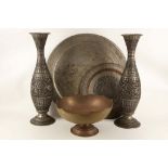 A collection of Persian metal work to include a chased brass bowl, a pair of tall vases with cast