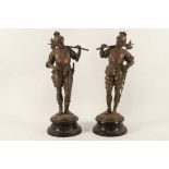 A pair of coppered Spelter halbadiers in the medieval manner, supported on socle bases, 37cm high (
