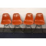 WITHDRAWN - CHARLES EAMES FOR HERMAN MILLER, a set of four 1950s orange fibreglass shell chairs on