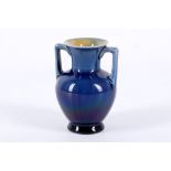 AN ARTS & CRAFTS LINTHORPE POTTERY TWIN-HANDLED MINIATURE VASE, with running blue glazes, circa