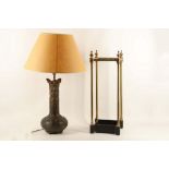 A spelter Art Nouveau vase with iris decoration converted to use as a table lamp, together with a