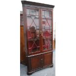 A large Georgian mahogany corner cabinet