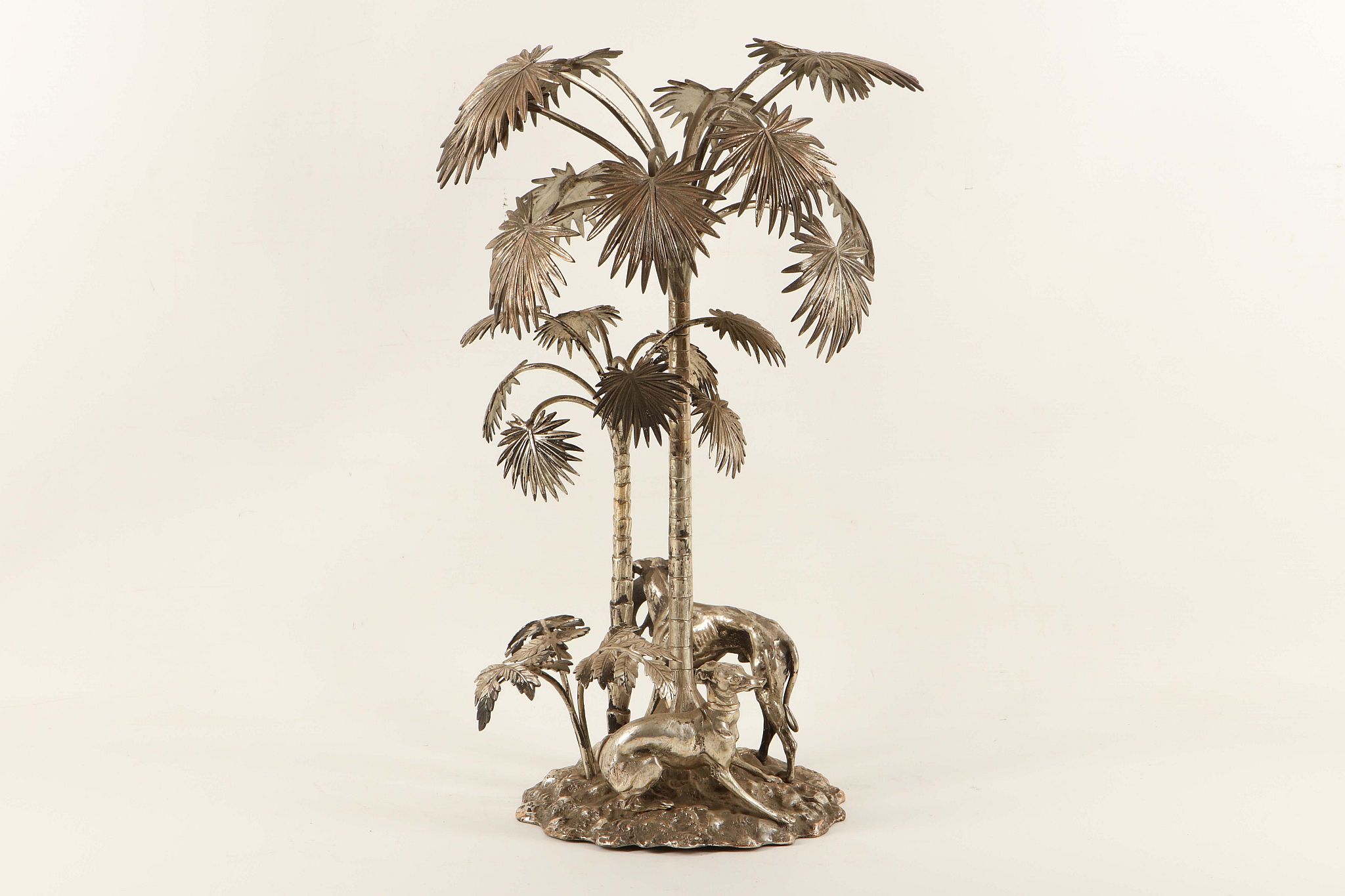 An impressive silver plated table centrepiece (possibly by Elkington), modelled as hunting digs with