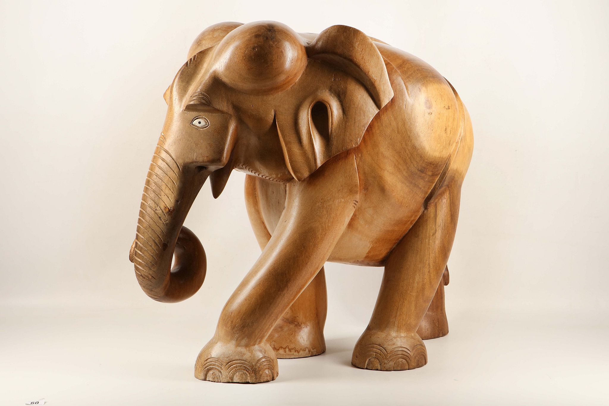 A floor standing carved wooden elephant from Sri Lanka.