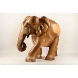 A floor standing carved wooden elephant from Sri Lanka.